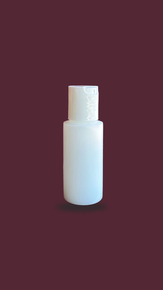 white bottle of aftertan extender with a white lid containing DHA